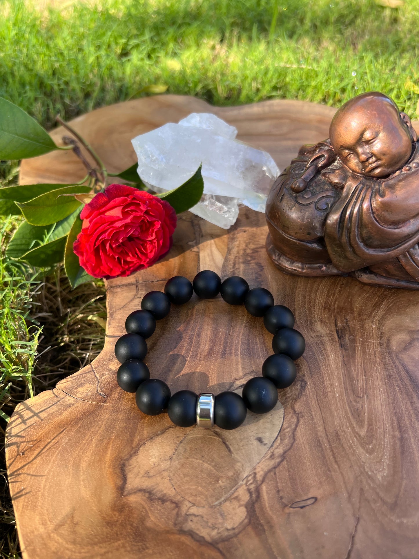 Matte Black Onyx Bracelet with a stainless steel accent bead